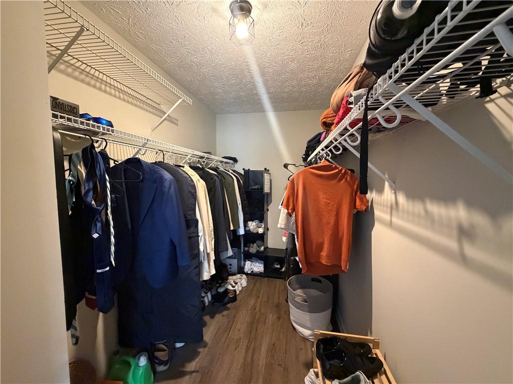 934 Bay Ridge Drive Lawrenceville, GA 30045 - Photo 61 of 78 a view of walk in closet with clothes and shoes