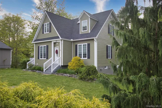 a front view of a house with garden and porch