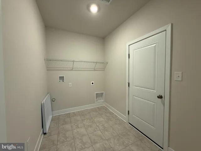 a kitchen with stainless steel appliances a sink a stove top oven a counter space and cabinets