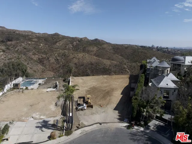 a view of a house with a mountain in the background