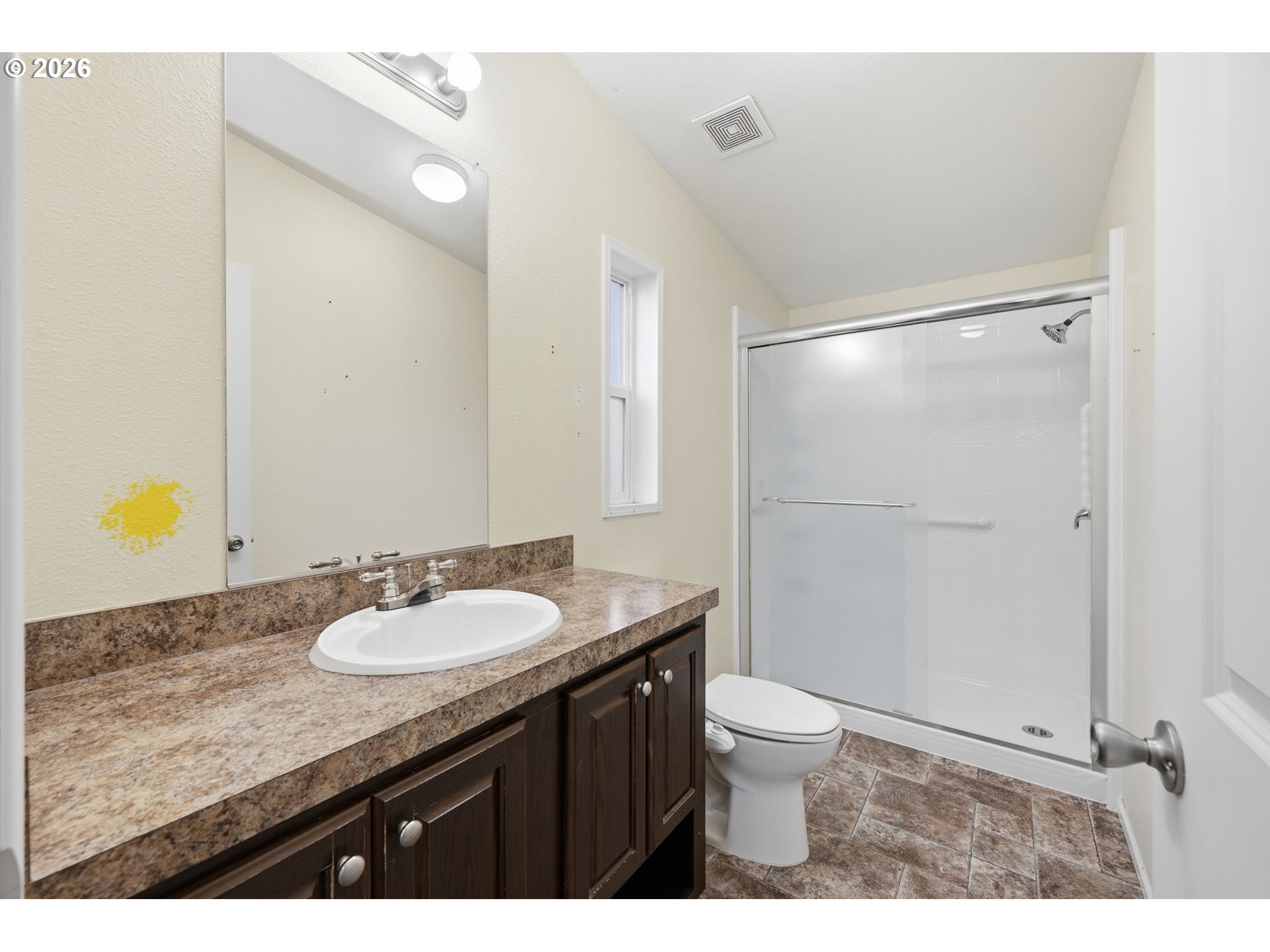 1475 Green Acres Road, Unit 150 Eugene, OR 97408 - Photo 18 of 34 a bathroom with a granite countertop sink toilet a mirror and shower