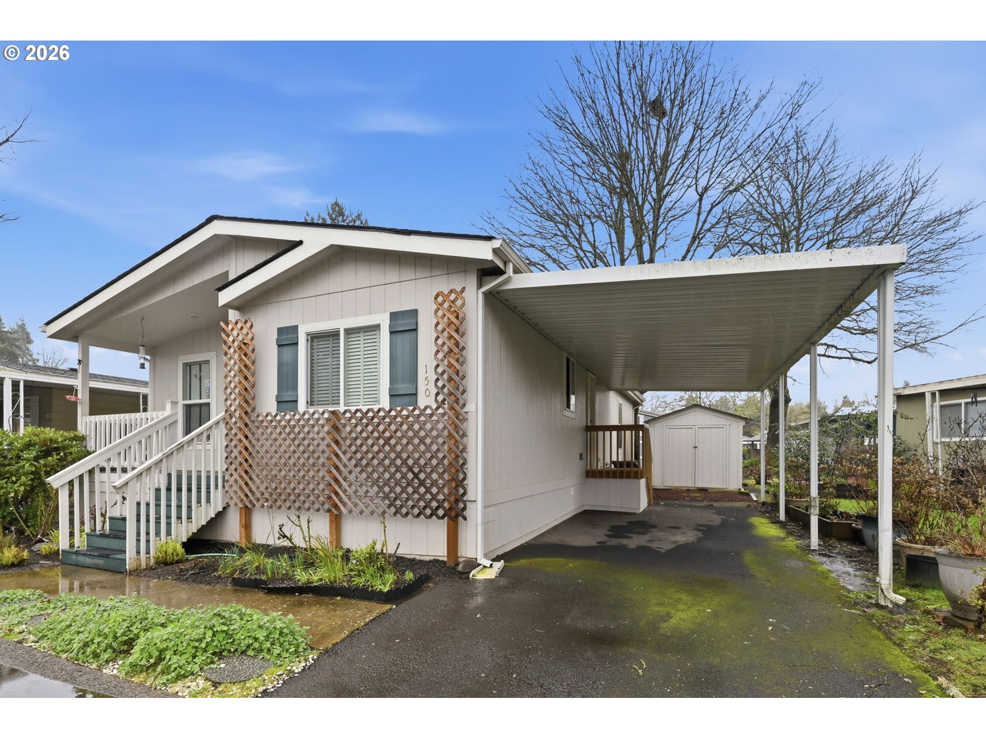 1475 Green Acres Road, Unit 150 Eugene, OR 97408 - Photo 27 of 34 a front view of a house with a yard