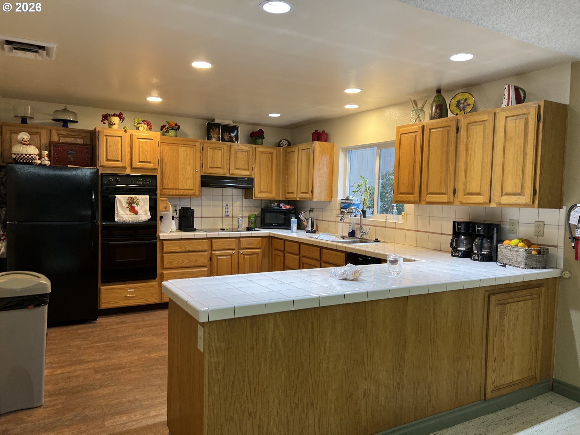 1475 Green Acres Road, Unit 150 Eugene, OR 97408 - Photo 34 of 34 a kitchen with stainless steel appliances granite countertop a sink refrigerator and cabinets