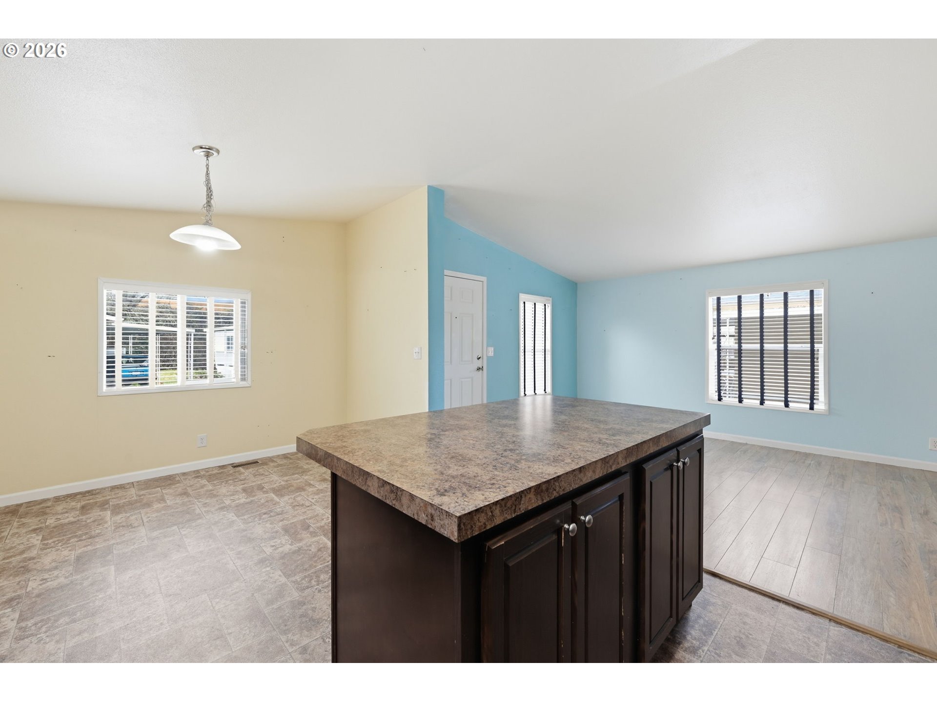 1475 Green Acres Road, Unit 150 Eugene, OR 97408 - Photo 8 of 34 a kitchen that has a sink a window and wooden floor