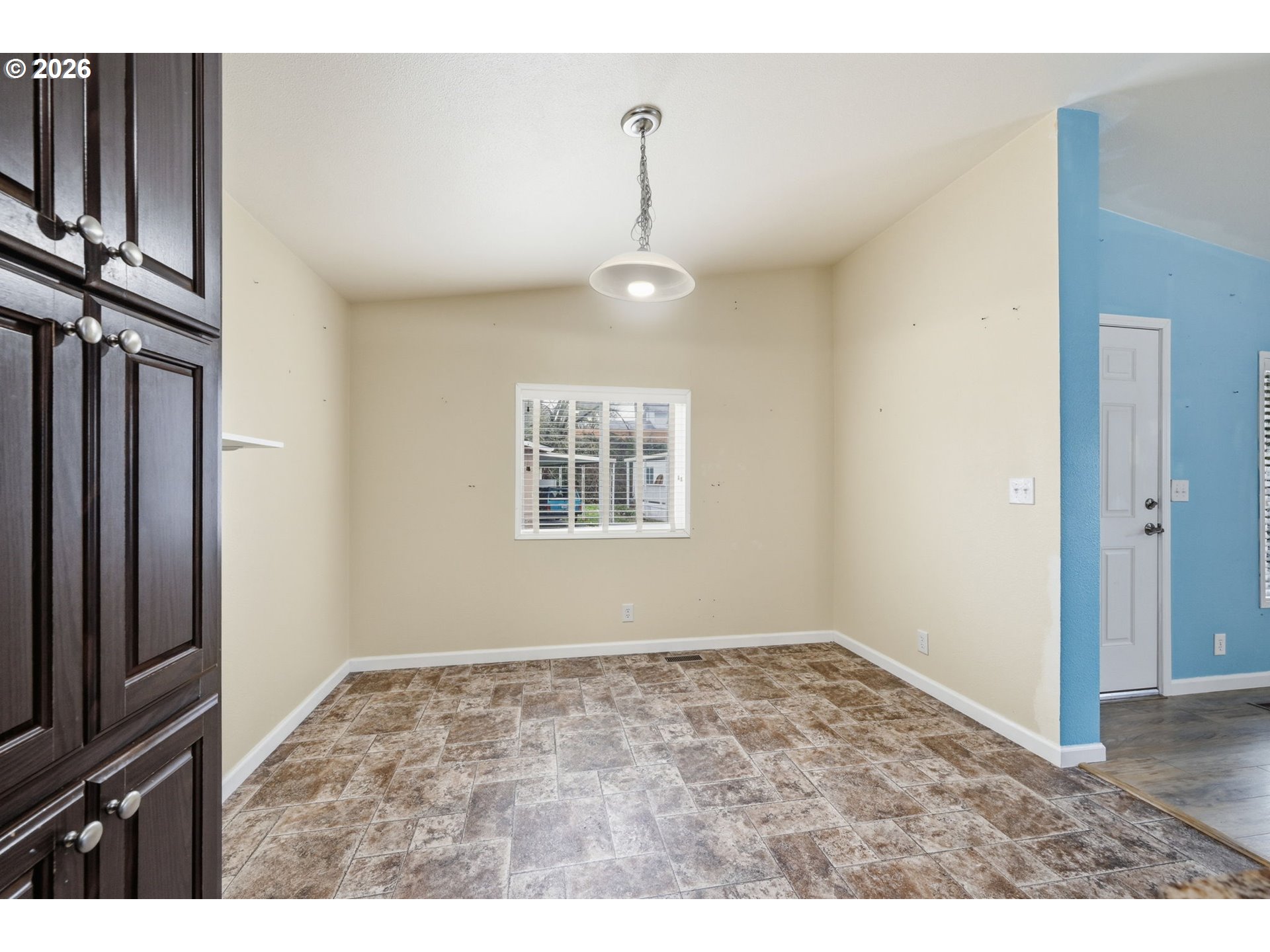 1475 Green Acres Road, Unit 150 Eugene, OR 97408 - Photo 10 of 34 a view of an empty room with wooden floor