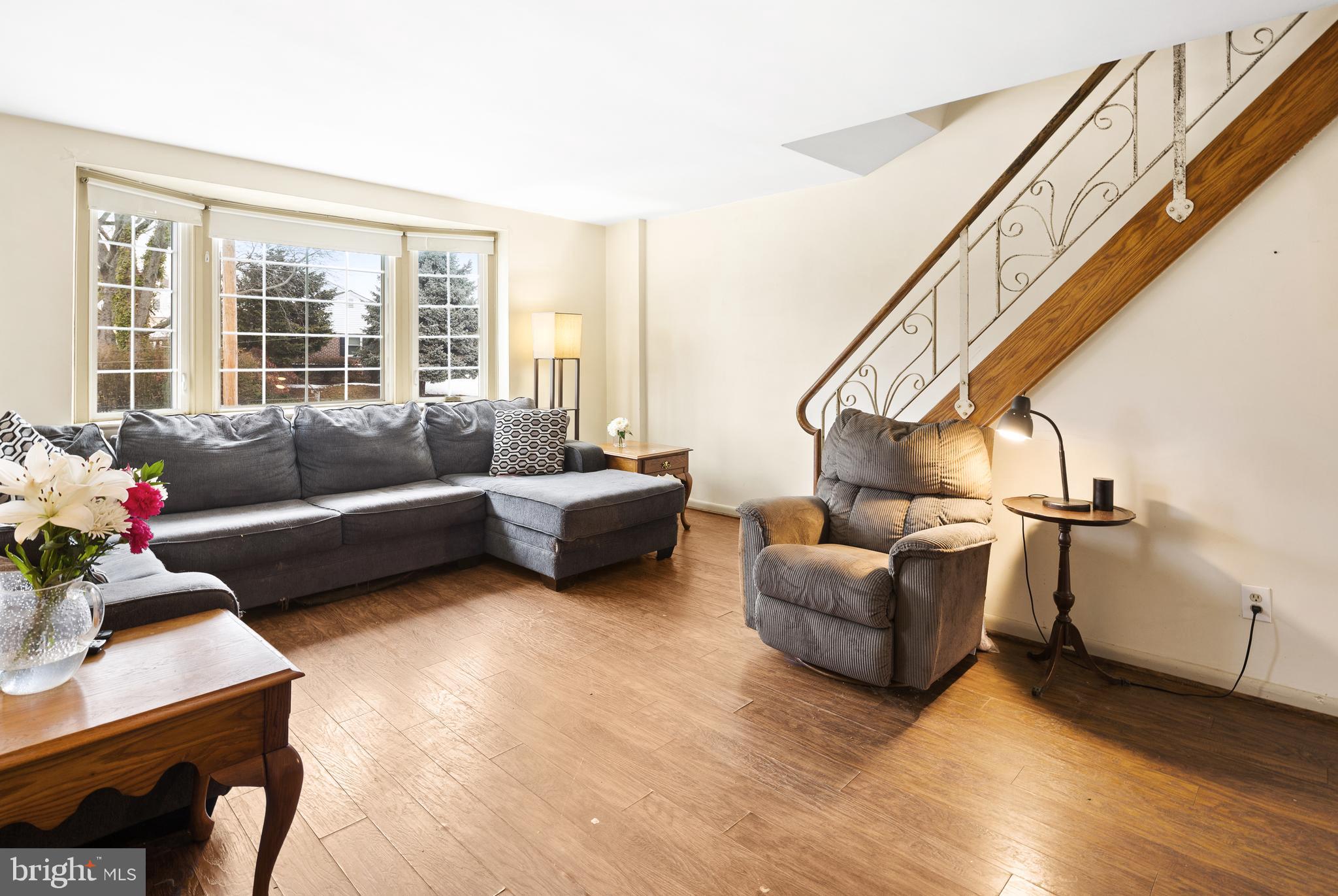 7851 Horrocks Street Philadelphia, PA 19152 - Photo 2 of 15 a living room with furniture and a potted plant