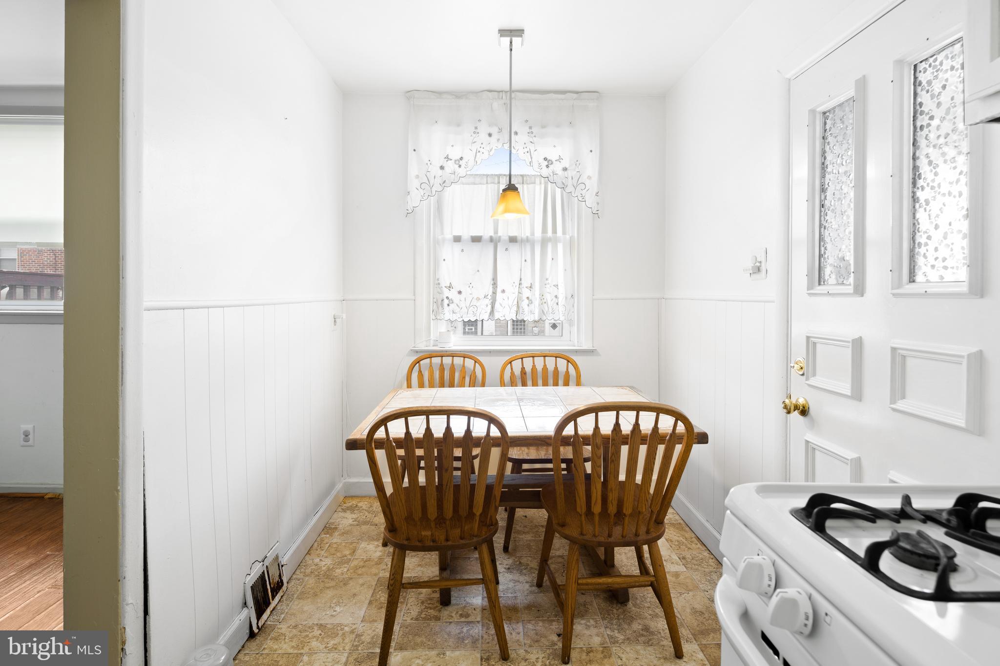 7851 Horrocks Street Philadelphia, PA 19152 - Photo 5 of 15 a view of a dining room with furniture and chandelier