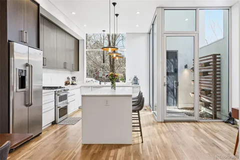 a dining area with furniture and a fireplace
