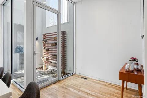 a kitchen with stainless steel appliances a sink a stove and white cabinets