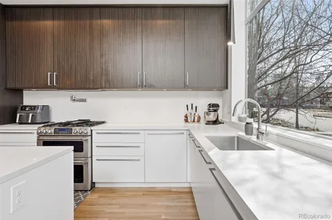 a room with a chair and a potted plant