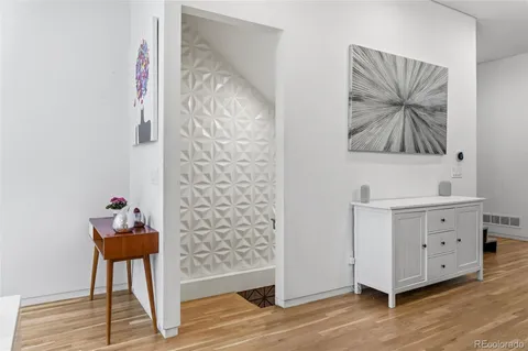 a view of entryway with stairs and wooden floor