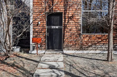 a brick building with a door and a window