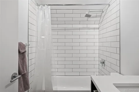a view of a hallway with washer and dryer