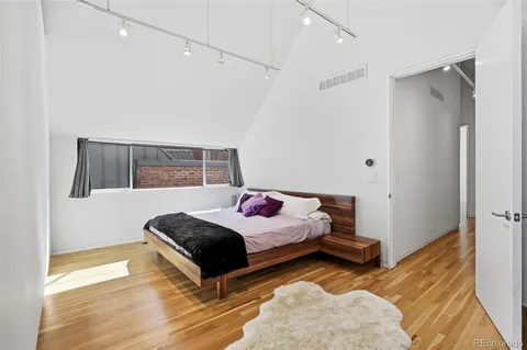 a bathroom with double vanity and a bathtub