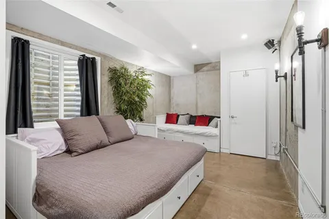 a living room with fireplace furniture and a flat screen tv