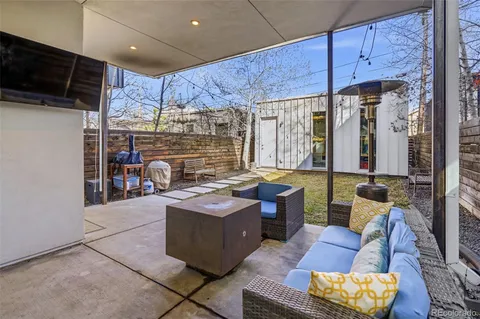 a view of a chairs and table in a patio