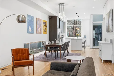 a view of a living room and entry gate