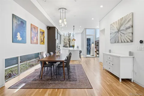 a kitchen with a refrigerator a sink and cabinets