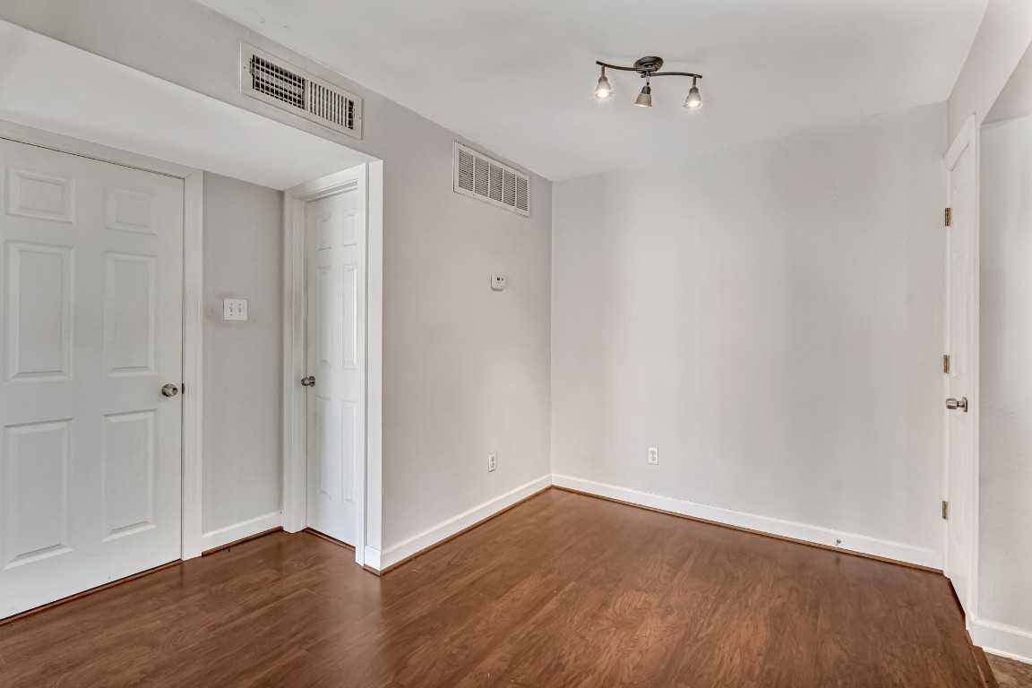 2800 Jeanetta Street, Unit 602 Houston, TX 77063 - Photo 11 of 29 a view of an empty room with wooden floor