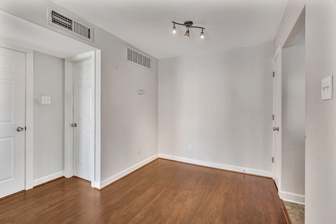 2800 Jeanetta Street, Unit 602 Houston, TX 77063 - Photo 12 of 29 a view of an empty room with wooden floor