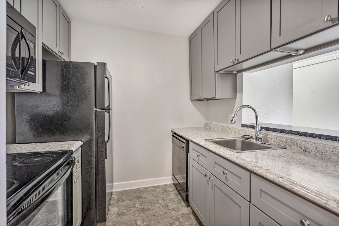 2800 Jeanetta Street, Unit 602 Houston, TX 77063 - Photo 15 of 29 a close view of a sink and a refrigerator
