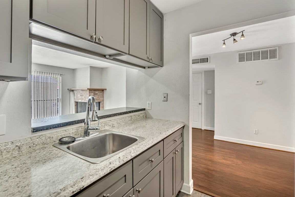 2800 Jeanetta Street, Unit 602 Houston, TX 77063 - Photo 16 of 29 a kitchen with a sink and cabinets