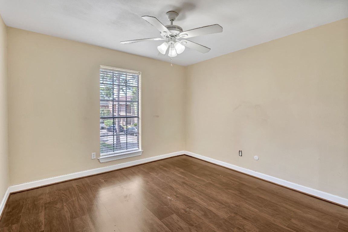 2800 Jeanetta Street, Unit 602 Houston, TX 77063 - Photo 19 of 29 wooden floor in an empty room with a window