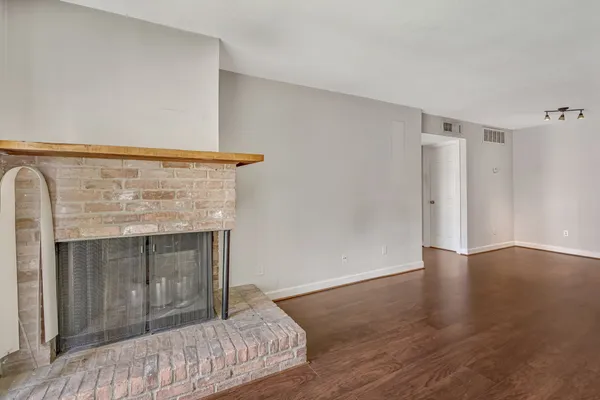 a bedroom with a bed and a fireplace