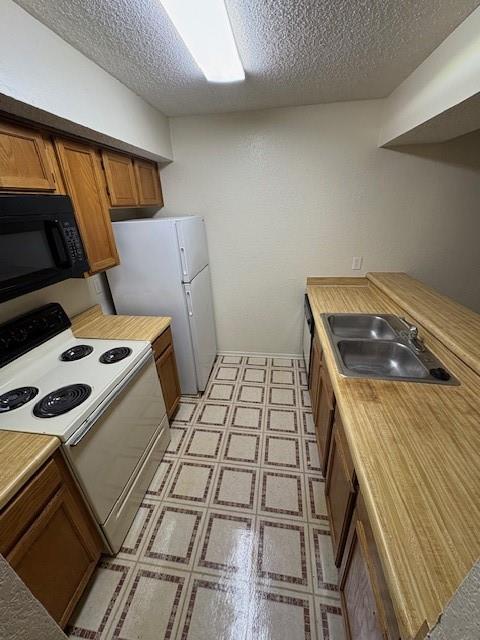 9813 Walnut Street, Unit 303 Dallas, TX 75243 - Photo 4 of 6 a bed sitting in a bedroom next to a window