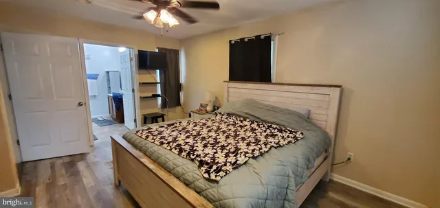 a living room with a couch and a chandelier