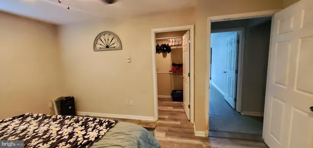 a bedroom with a bed and a view of bedroom