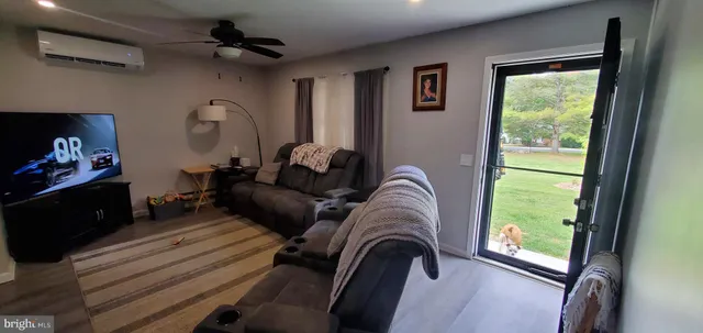 a living room with furniture and a window