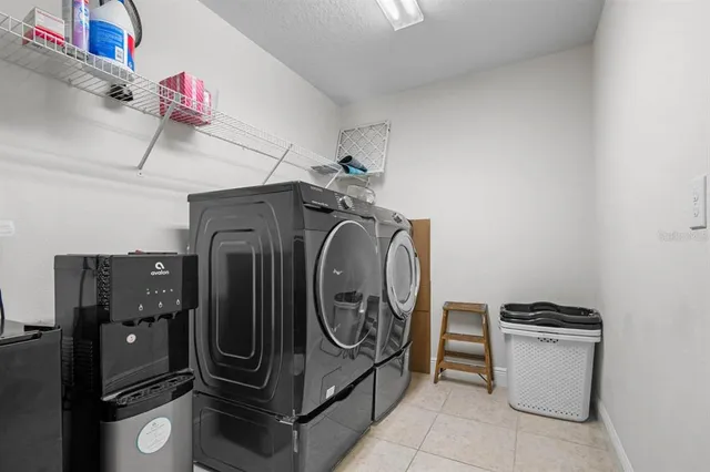 a utility room with dryer and washer