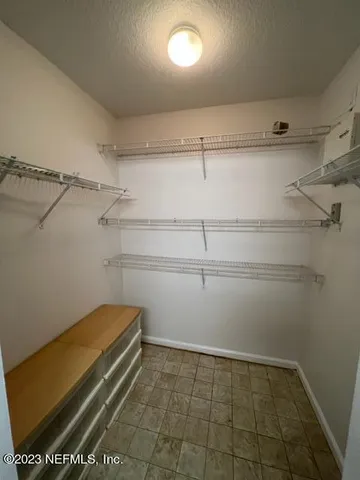 a view of a room with racks on the wall