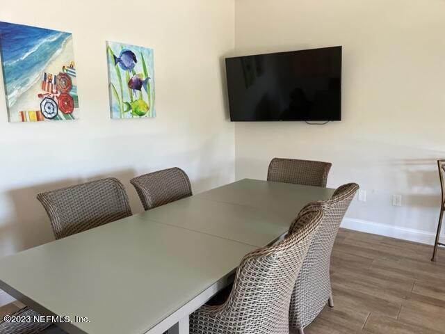 400 Sandiron Circle, Unit 418 Ponte Vedra Beach, FL 32082 - Photo 20 of 25 a view of a livingroom with furniture and wooden floor