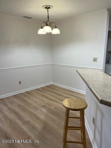 400 Sandiron Circle, Unit 418 Ponte Vedra Beach, FL 32082 - Photo 6 of 25 a kitchen with a table and chairs