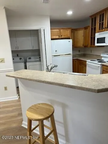 a kitchen with stainless steel appliances granite countertop a refrigerator sink and cabinets