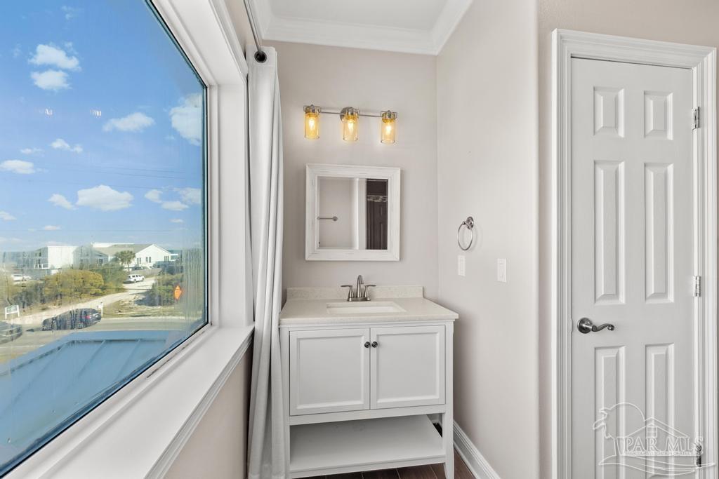 321 Gulfview Lane Perdido Key, FL 32507 - Photo 31 of 57 a bathroom with a sink vanity and a mirror