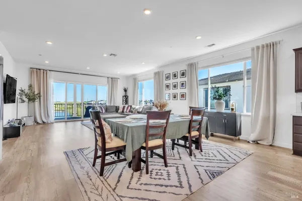 a living room with furniture window and wooden floor