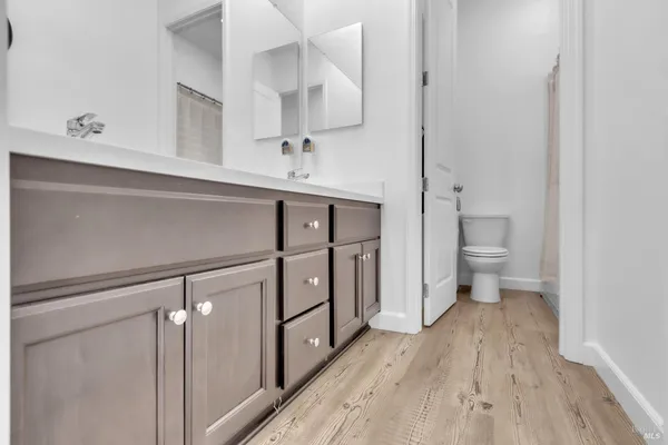 a kitchen with stainless steel appliances a stove refrigerator sink and cabinets