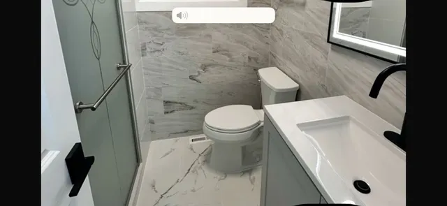 a bathroom with a sink and toilet