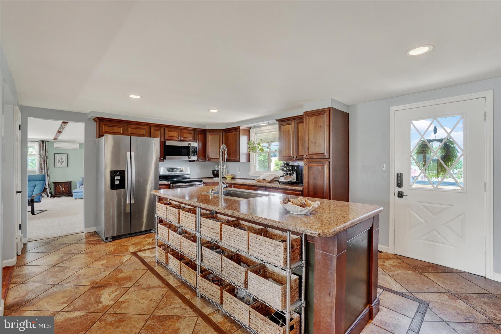 13174 Mont Road Felton, PA 17322 - Photo 24 of 39 a kitchen with stainless steel appliances granite countertop a refrigerator and a sink
