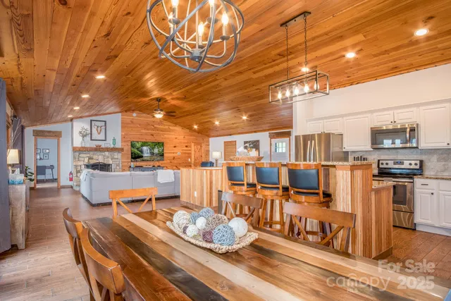 a living room with furniture and a kitchen view