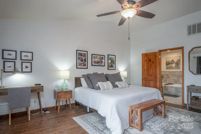 a bedroom with a bed and a table in it