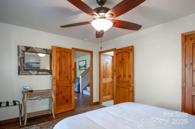 a bathroom with a toilet a sink and a mirror