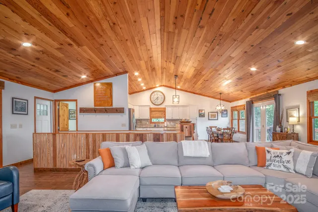 a living room with furniture and a clock