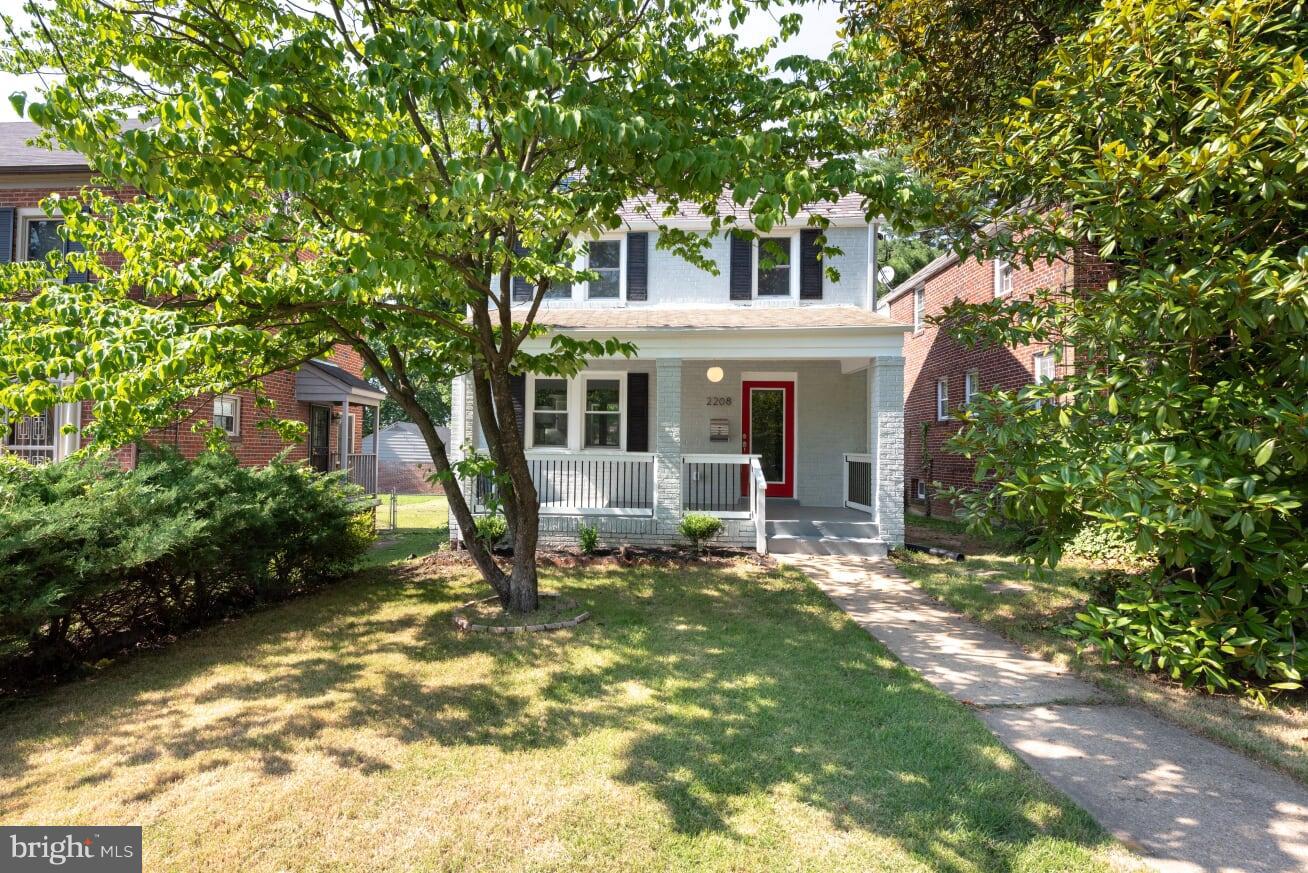 2208 Shepherd Street Northeast Washington, DC 20018 - Photo 1 of 19 front view of a house with a yard