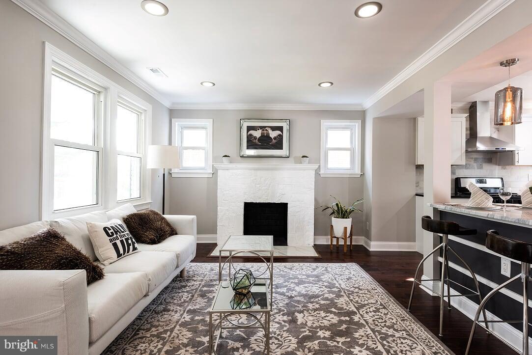 2208 Shepherd Street Northeast Washington, DC 20018 - Photo 2 of 19 a living room with furniture and a fireplace