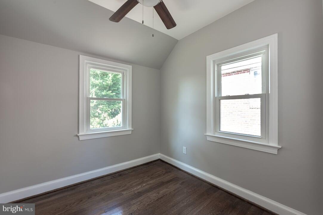 2208 Shepherd Street Northeast Washington, DC 20018 - Photo 14 of 19 a view of an empty room with wooden floor and a window