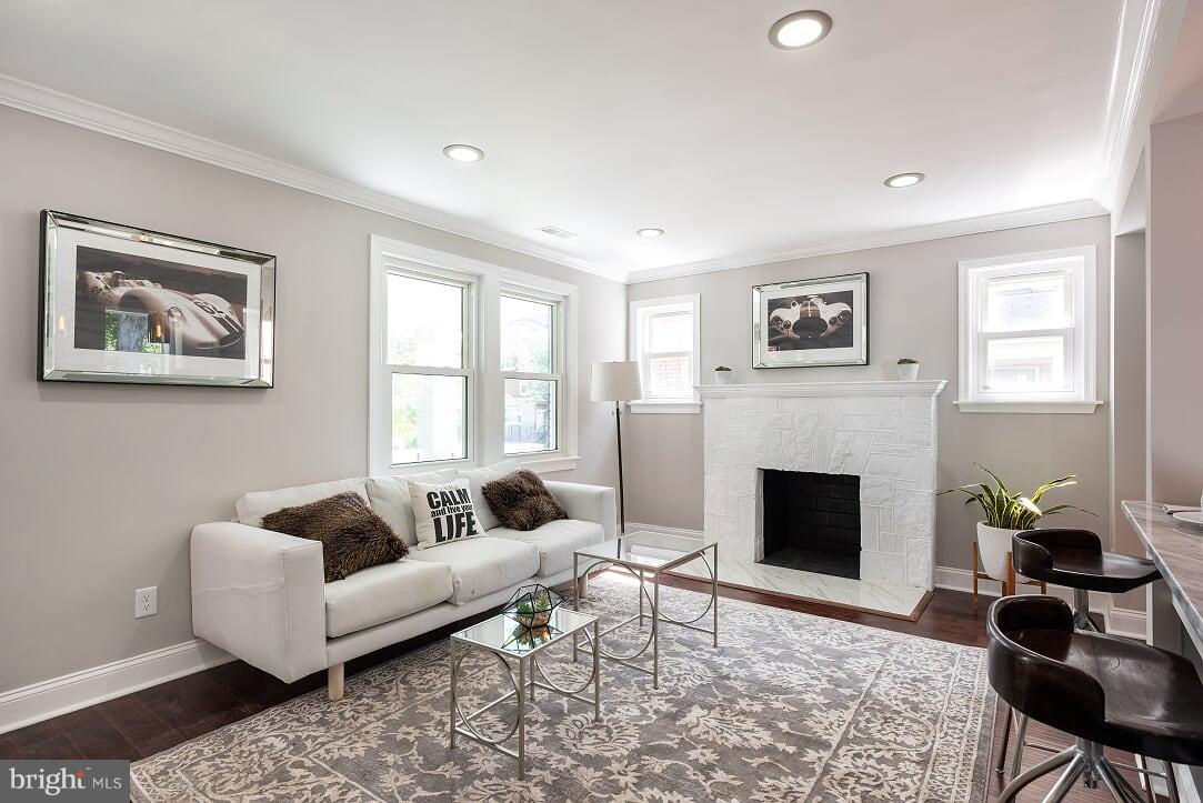 2208 Shepherd Street Northeast Washington, DC 20018 - Photo 3 of 19 a living room with furniture and a fireplace